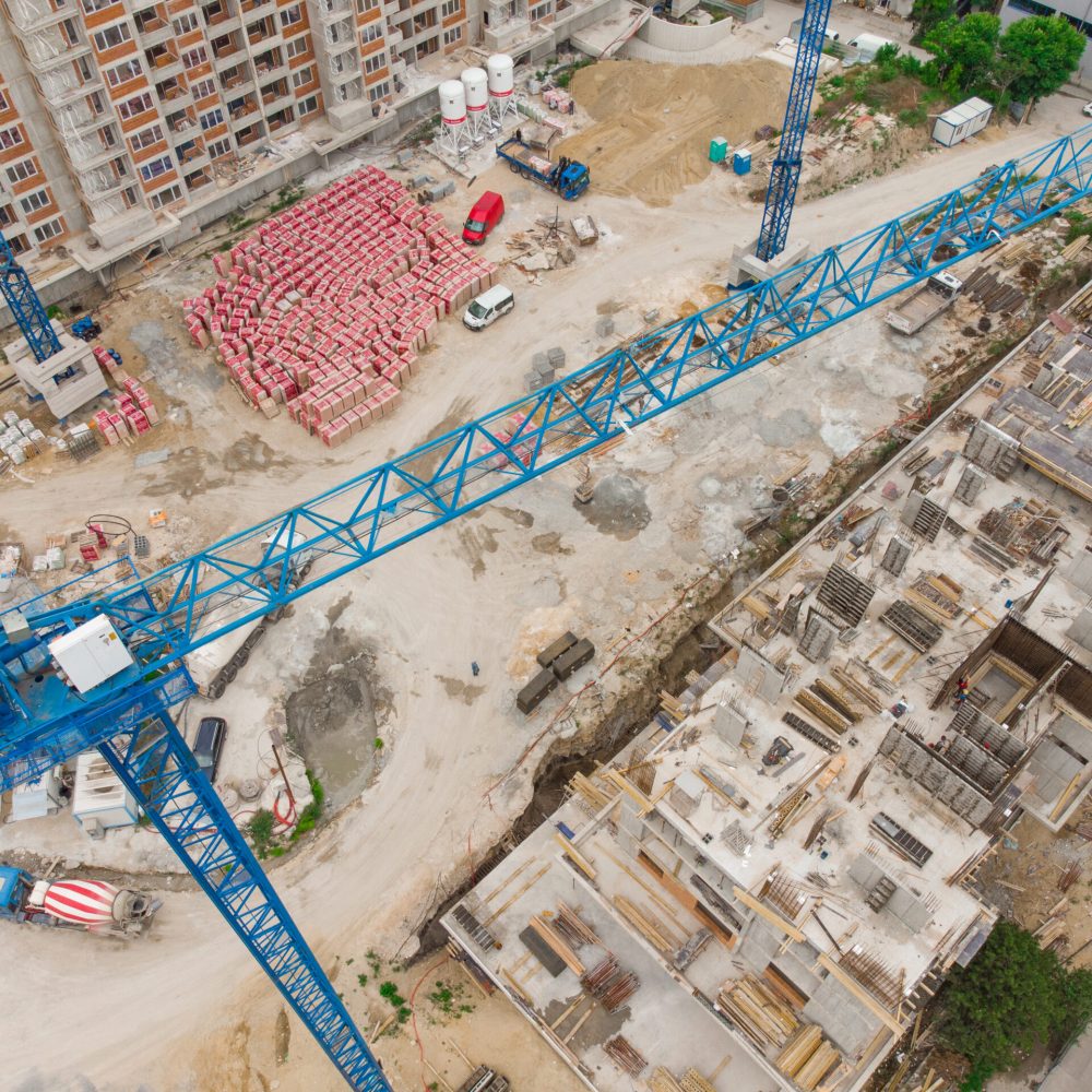 Busy Construction Site and Construction Equipment Aerial top view